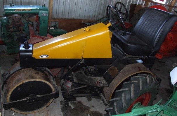 A small yellow Aveling Barford land roller.