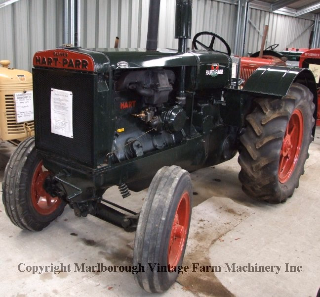 A dark green Oliver Hart-Parr 28-44 tractor.